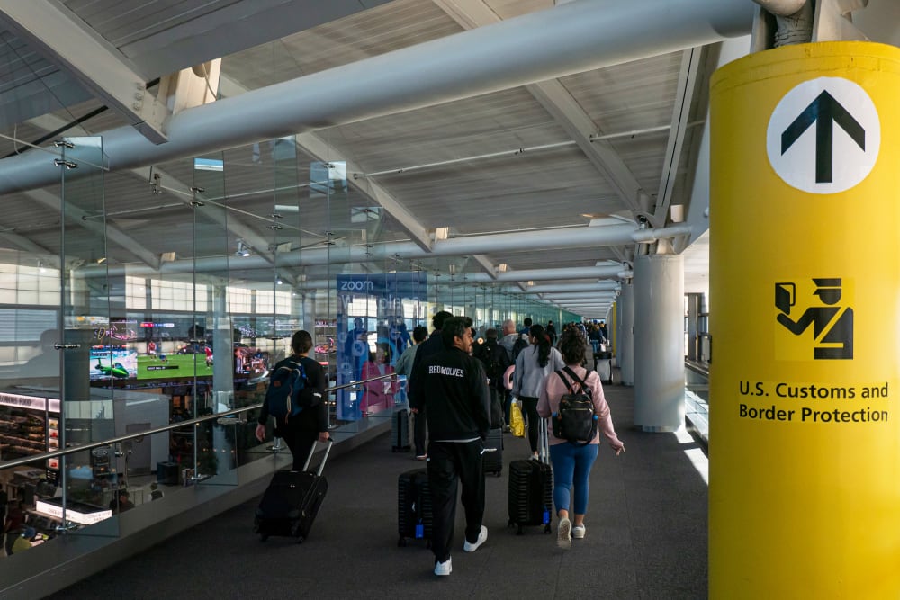Passengers walk through the terminal toward U.S. Customs and Border Protection at New Jersey's Newark Liberty International Airport on Nov. 3, 2024.