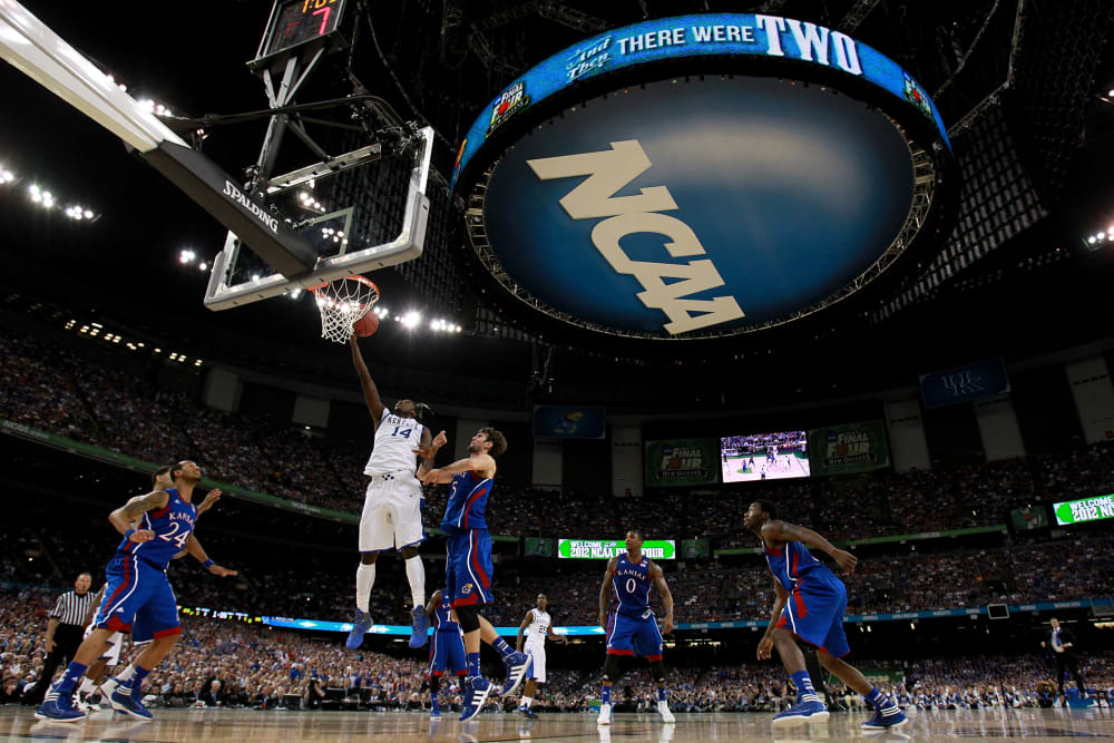 The NCAA logo is seen as the Kentucky Wildcan as the Kentucky Wildcats play against the Kansas Jayhawks in the first half in the National Championship Game of the 2012 NCAA Division I Men's Basketball Tournament on April 2, 2012 in New Orleans, Louisiana.