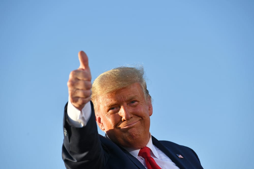 President Donald Trump gives a thumbs up as he leaves a rally in Tucson, A.Z.