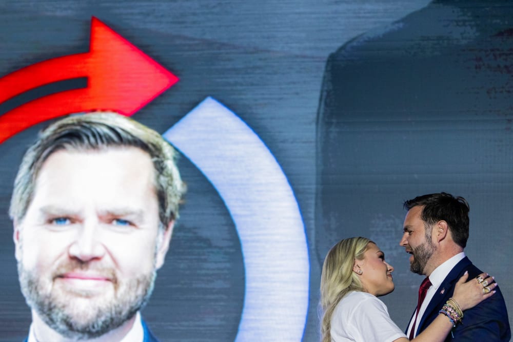 Erika Kirk and Vice President JD Vance embrace at the Pavilion at Ole Miss at the University of Mississippi.
