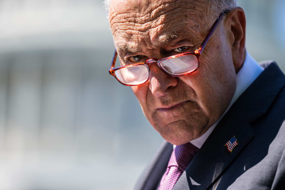 Senate Minority Leader Charles Schumer attends a news conference outside the Capitol.
