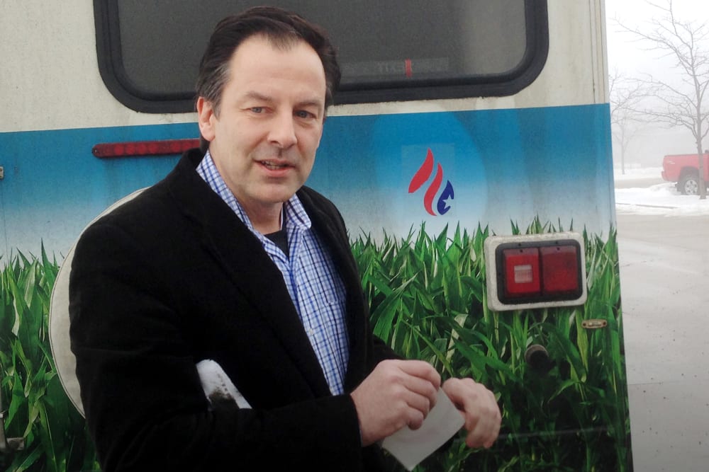 Rick Tyler, communications director for Sen. Ted Cruz, R-Texas presidential campaign, speaks speaks after affixing a Cruz sticker on an RV of a group that is openly critical of Cruz, Jan. 7, 2015, in Storm Lake, Iowa. (Photo by Scott Bauer/AP)
