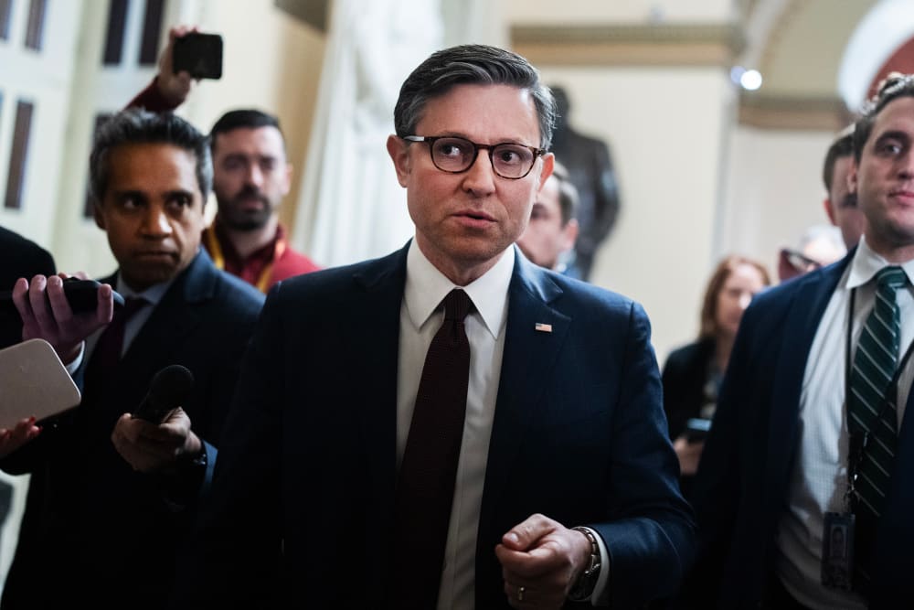 Speaker of the House Mike Johnson, R-La., talks with reporters in the U.S. Capitol during the last votes of the year.