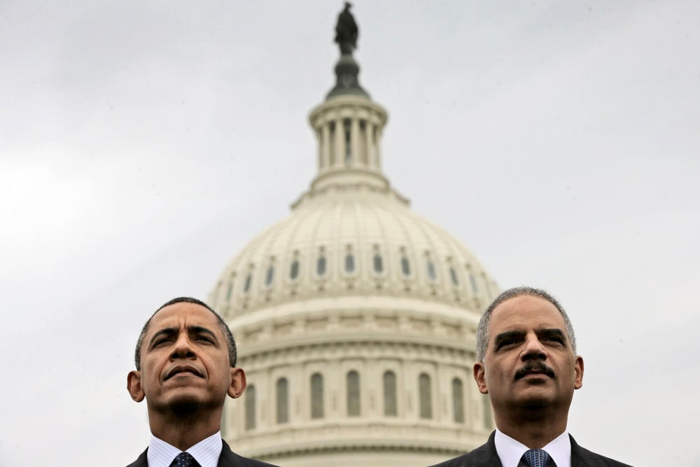 Barack Obama sits with Attorney General Eric Holder during the 32nd annual the National Peace Officers Memorial Service, May 15, 2013, on Capitol Hill in Washington, honoring law enforcement officers who died in the line of duty.