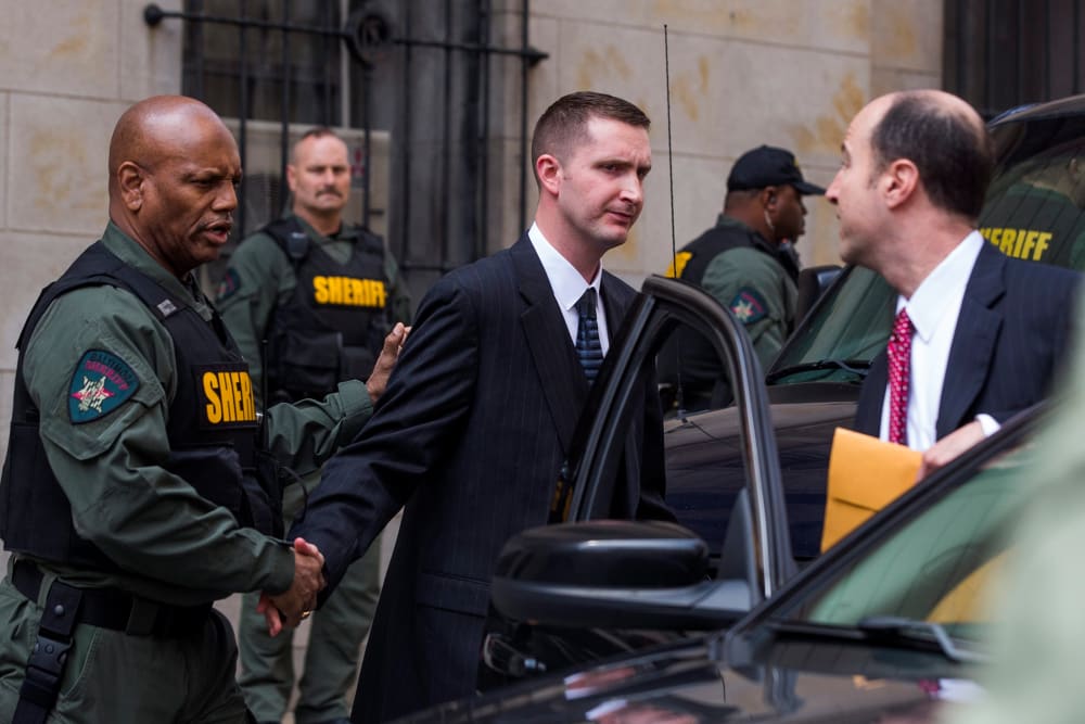 Baltimore police officer Edward Nero, along with his attorney Marc Zayon, leaves the courthouse after being acquitted of all charges in the death of Freddie Gray in Baltimore, Md., May 23, 2016. (Photo by Jim Lo Scalzo/EPA)