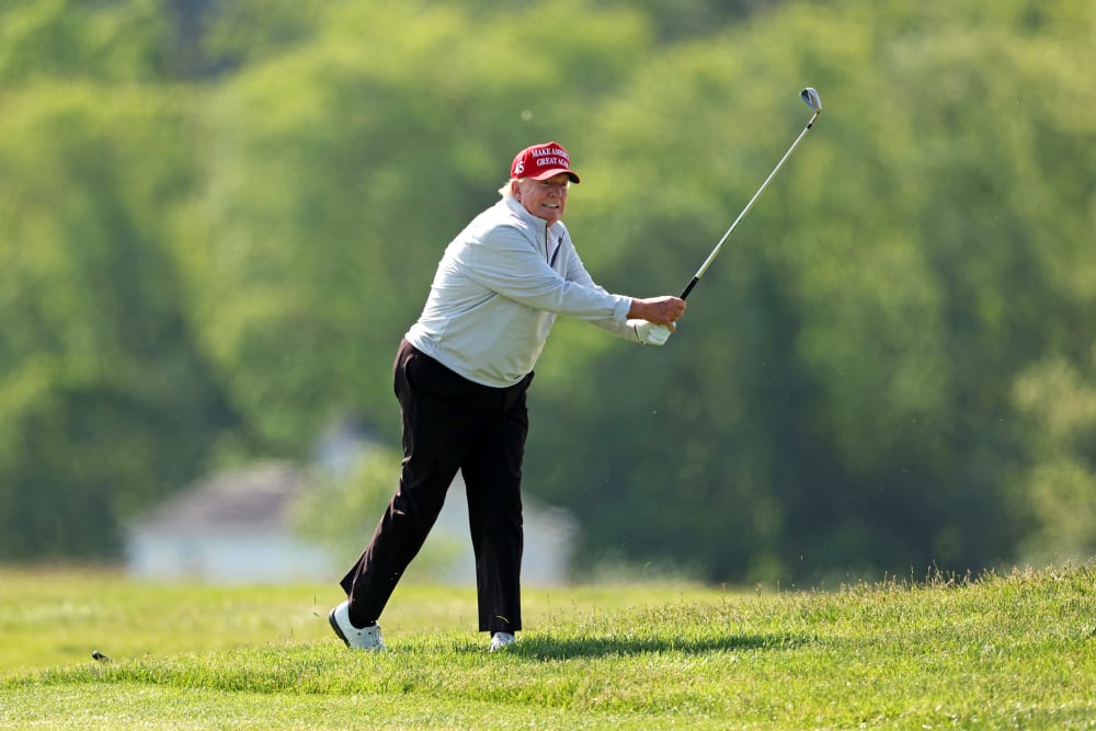 Donald Trump playing golf.