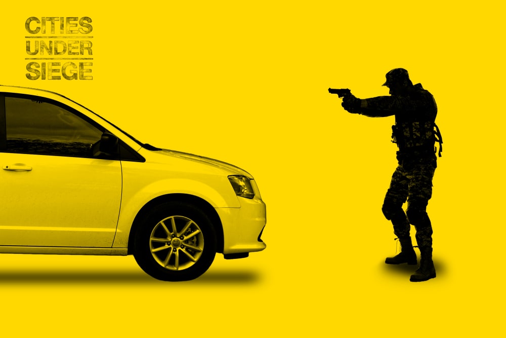 A photo illustration of an ICE agent pointing a gun at a minivan while standing in front of it.