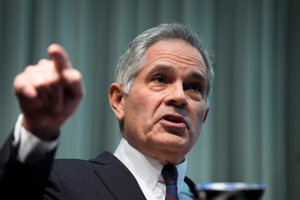 Larry Krasner gestures with his hand.