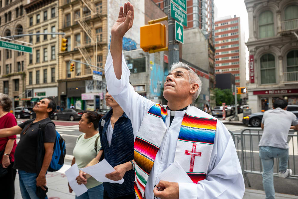 Members of the New Sanctuary Coalition (NSC) participate in a weekly prayer outside of immigration court at the Jacob K. Javits Federal Building on July 10, 2025, in New York City.