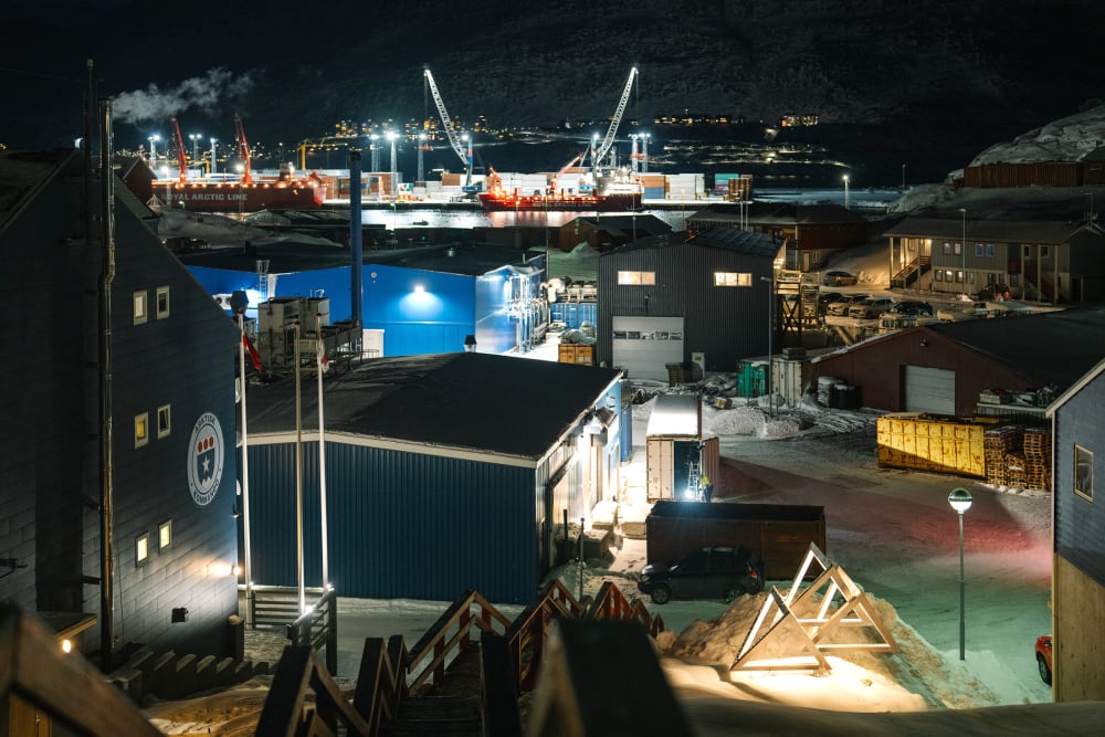 A view of Arctic Command in Nuuk at night, shot from a high angle.