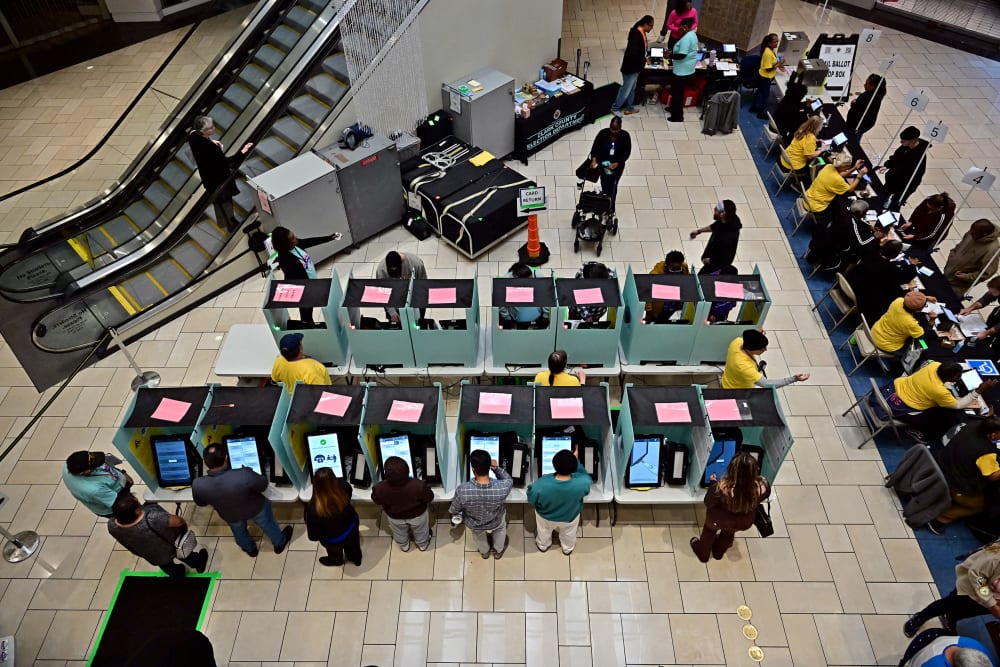 An aerial photo of people voting at a mall.
