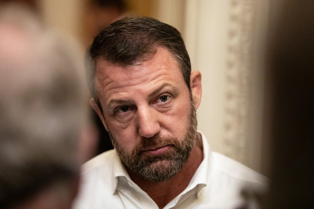 A close up of Markwayne Mullin cocking his head.