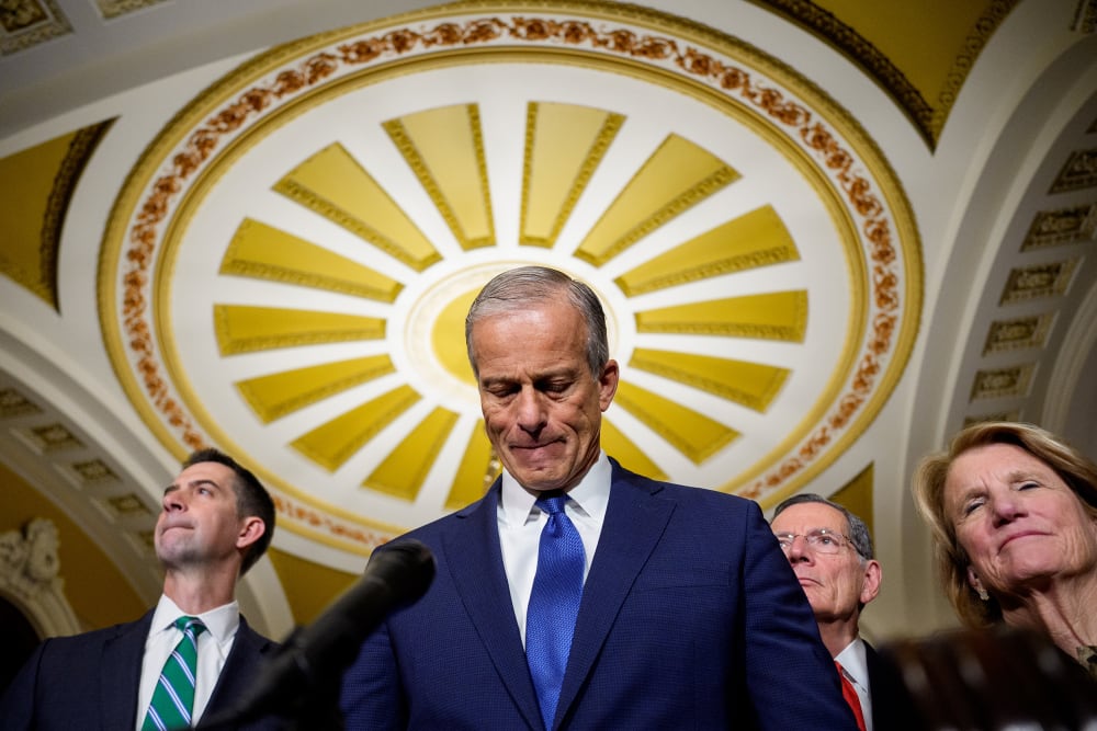 From left to right: Tom Cotton, John Thune, John Barrasso and Shelley Moore Capito stand in the Capitol, seen from a low angle.