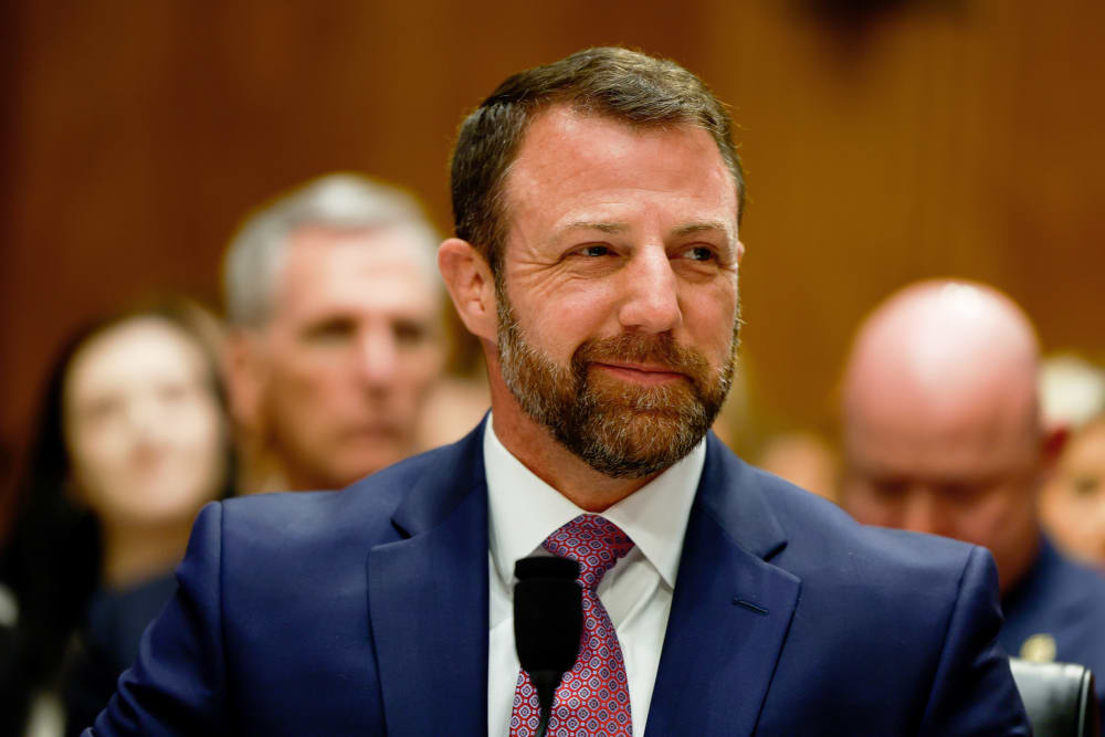 Markwayne Mullin smiles.