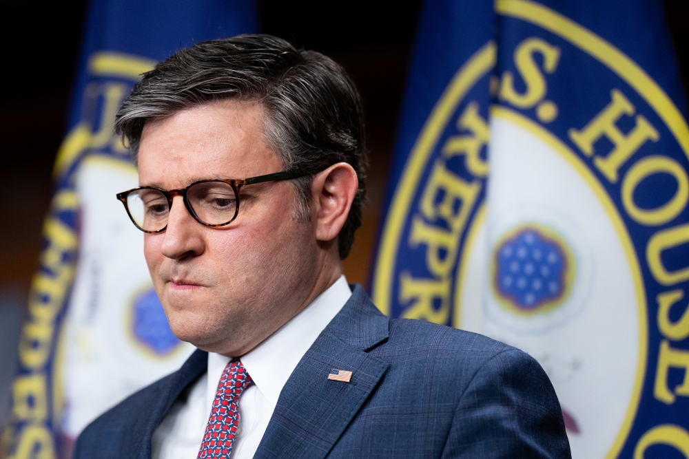 Mike Johnson looking down.