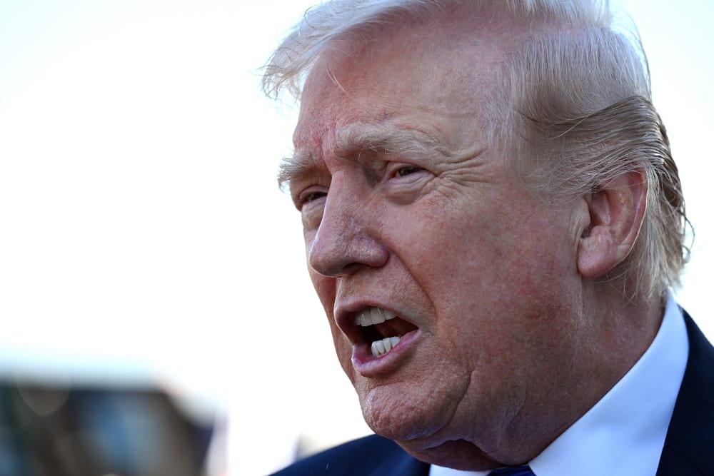 in this closeup photo, donald trumps is seen speaking looks like loudly