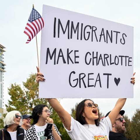 Protesters gather at First Ward Park for the 'No Border Patrol In Charlotte' rally.