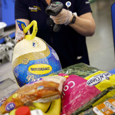 A cashier scans a turkey at a Walmart in Burbank, C.A.