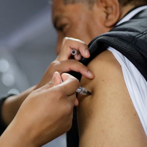 A health worker administers a vaccine during a mass vaccination campaign in Mexico City, Mexico.