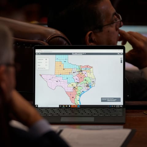 State representatives look at a congressional redistricting map in Austin, T.X.