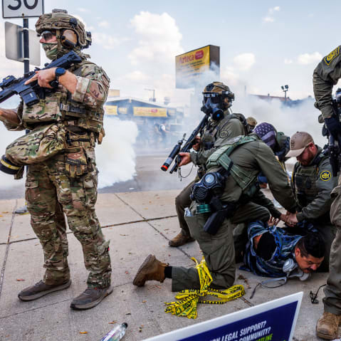 Federal officers detain a person in Chicago, IL.