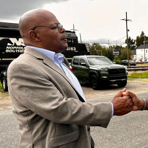 Calvin Duncan, left, shakes hands with exoneree Raymond Flanks in New Orleans.
