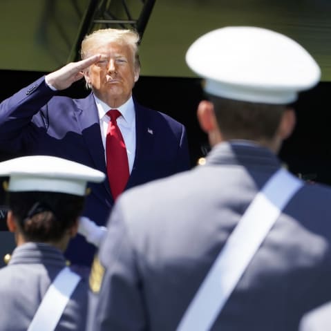 US President Donald Trump salutes cadets at a US Military Academy graduation ceremony.