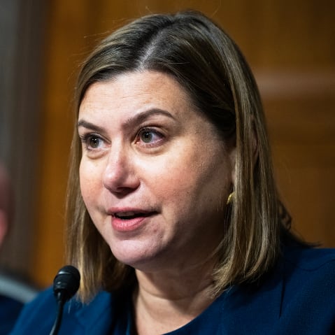 Sen. Elissa Slotkin, with Sen. Mark Kelly in the background.