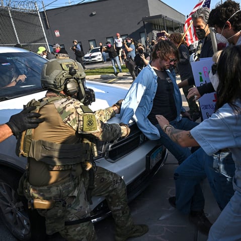 Demonstrators protesting outside the U.S Immigration & Customs Enforcement facility tussle with federal agents on Sept. 19, 2025, in Broadview, Illinois.