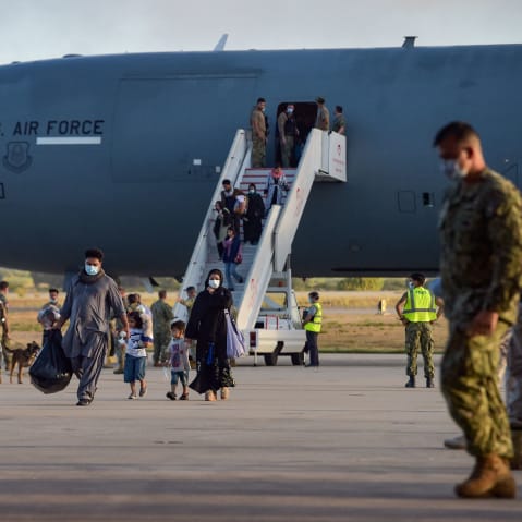 Afghan refugees disembark from a U.S. Air Force aircraft in Spain after an evacuation flight from Kabul on Aug. 31, 2021.