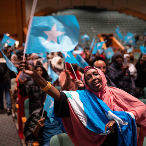 Members of the Somali community await the arrival of the president of Somalia at the Minneapolis Convention Center in Minneapolis.
