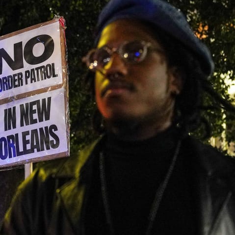 Activists demonstrate against potential immigration enforcement raids.