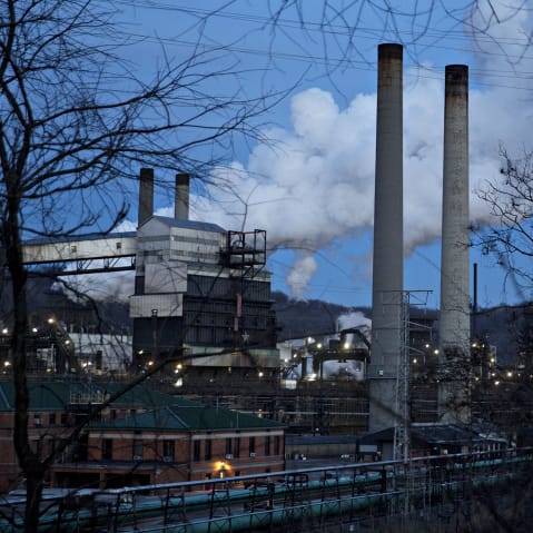 Emissions rise from the United States Steel Corp. Clairton Plant coke manufacturing facility at dusk in Clairton, PA.