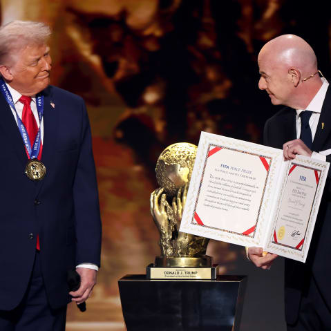 President of FIFA Gianni Infantino, right, presents President Donald Trump with the FIFA Peace Prize during the FIFA World Cup 2026 Official Draw at John F. Kennedy Center for the Performing Arts in Washington, D.C.