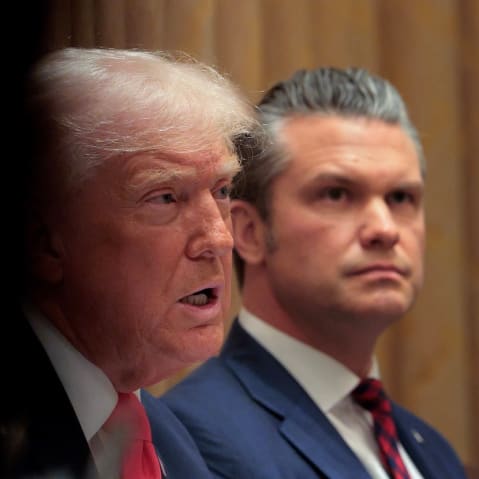 Donald Trump and Pete Hegseth sit in a Cabinet meeting