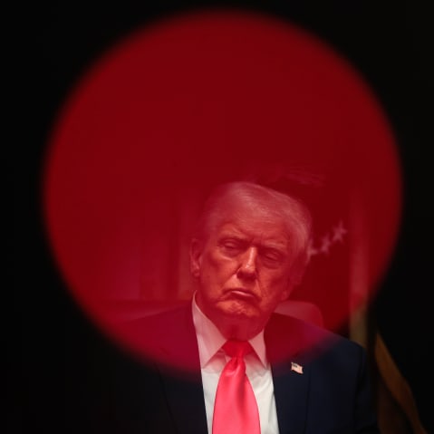 President Donald Trump sits in the Cabinet room.