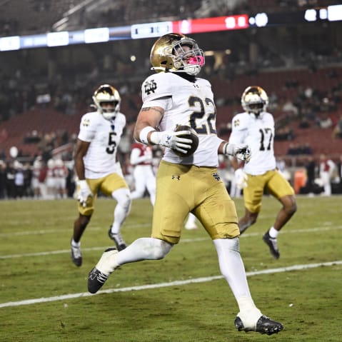 Aneyas Williams of the Notre Dame Fighting Irish runs the ball for a touchdown against the Stanford Cardinal.