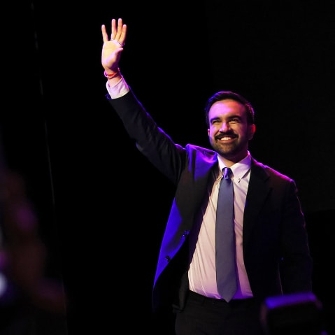 Zohran Mamdani waving to the crowd in Brooklyn, NYC.