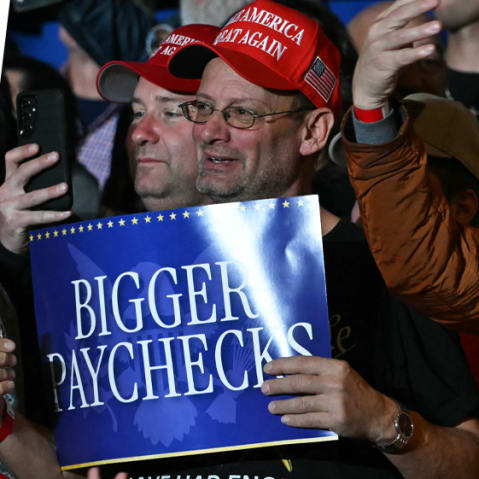 Chris Hayes; Attendees holding signs that read "BIGGER PAYCHECKS" as US President Donald Trump delivers remarks.