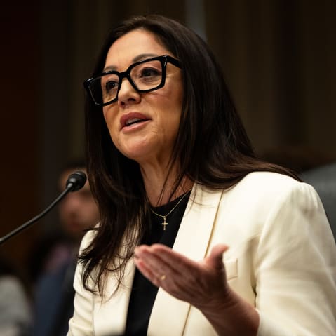 Lori Chavez-DeRemer, wearing a cross necklace, gestures during her confirmation hearing to be Secretary of Labor in Washington, D.C.