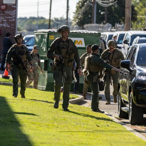 Officers with the Shelby County Sheriff's Office assist the motorcade of US Attorney General Pam Bondi, Secretary of War Pete Hegseth and White House Deputy Chief of Staff Stephen Miller in Memphis, T.N.