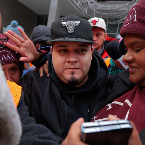 Kilmar Abrego Garcia surrounded by people at the U.S. Immigration and Customs Enforcement Baltimore Field Office.