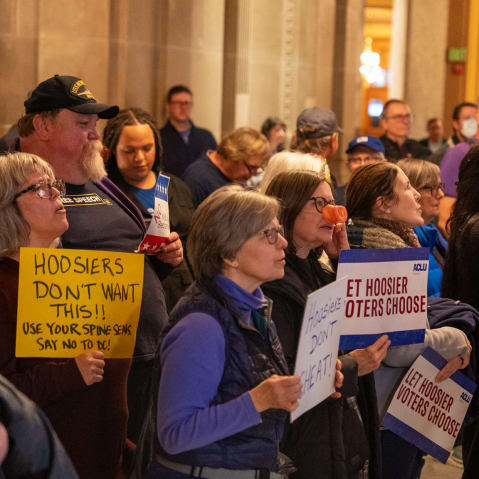 Demonstrators protest at the Indiana Statehouse in Indianapolis, I.N., on Dec. 11, 2025.