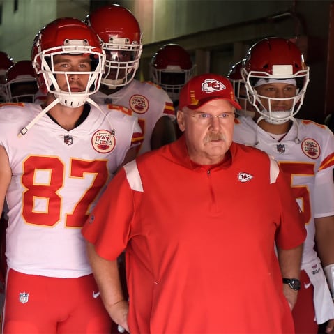 Head Coach Andy Reid, Travis Kelce #87 and Patrick Mahomes #15 of the Kansas City Chiefs look on before taking the field against the Washington Football Team.