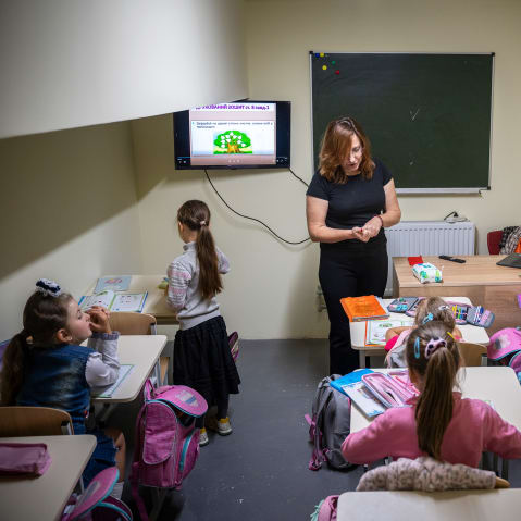 First-year students sit in class at an underground school equipped as a bomb shelter in Voznesenske, Chernihiv Region, Ukraine, on Sept. 15, 2025.