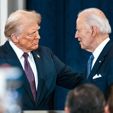 Donald Trump shakes hands with Joe Biden at Trump's inauguration on Jan. 20, 2025 in the U.S. Capitol Rotunda.
