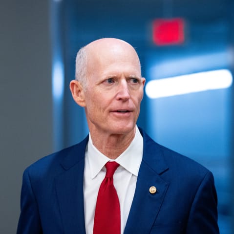 Sen. Rick Scott arrives for a vote at the Capitol.