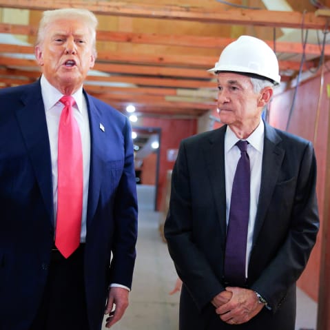 President Trump stands to the left of Fed Chair Jerome Powell as he speaks to the media.