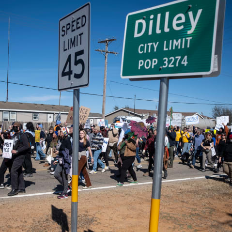 DILLEY, TEXAS - JANUARY 28: People protest against Immigration and Customs Enforcement as they march toward the South Texas Family Residential Center on January 28, 2026 in Dilley, Texas. A federal judge temporarily blocked the deportation of 5-year-old Liam Conejo Ramos and his father, Adrian Conejo Arias, who were arrested in Minneapolis after the father had picked the boy up from school. They were then taken to the South Texas Family Residential Center, an immigration detention center outside San Antonio, where they remain. (Photo by Joel Angel Juarez/Getty Images)
