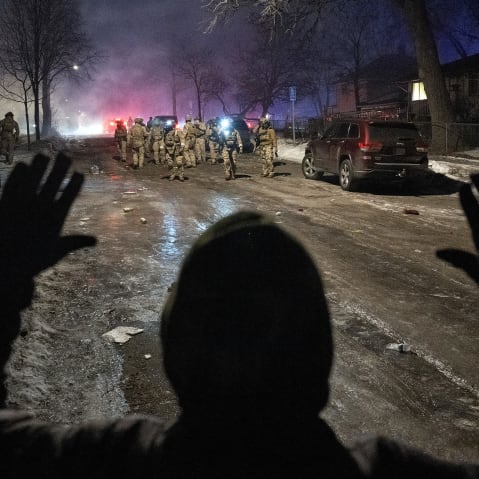 Federal law enforcement officers during confrontations with residents in Minneapolis.